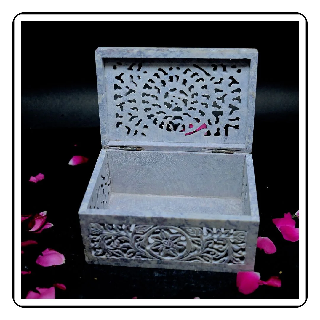 Handmade hexagonal soapstone box with fine craftsmanship and smooth surface.