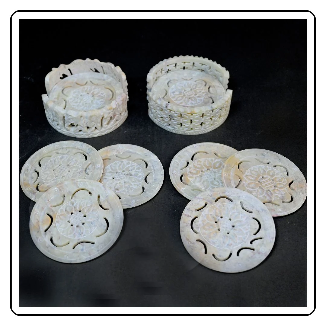 "Set of two round soapstone coasters with a minimalist, modern design