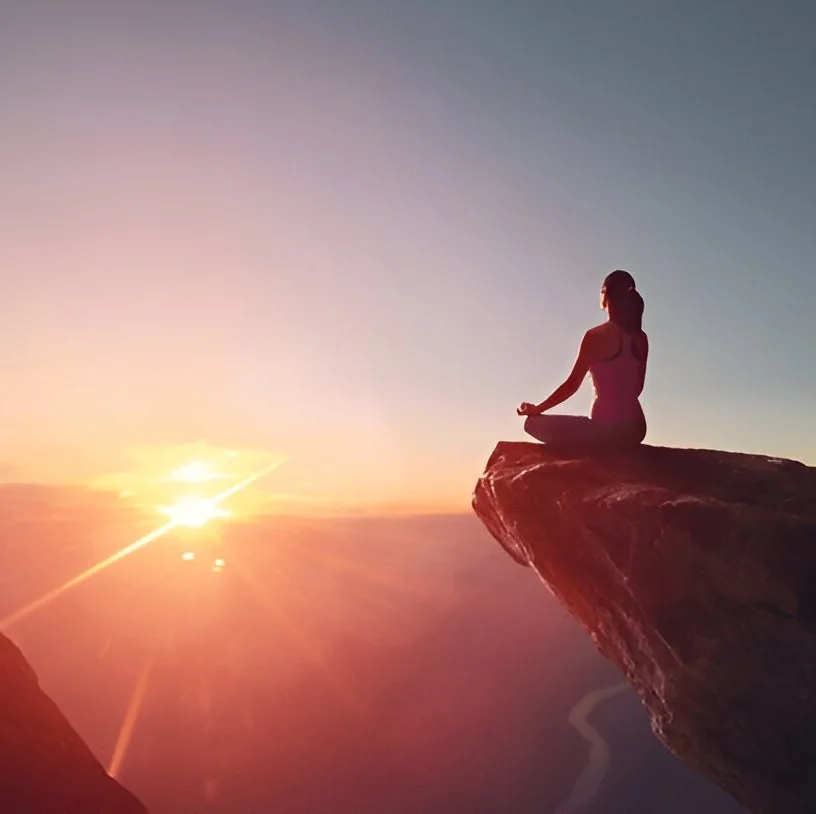 Woman finding Balance yoga on Mountain
